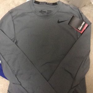 Long sleeve gray Nike pro stay warm under armor.